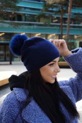 Knitted blue cashmere and wool hat with pompom blue