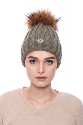 Knitted light green wool hat with pompom raccoon