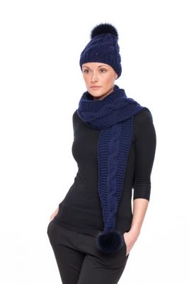 Knitted blue wool hat with blue pompom