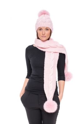 Knitted pink wool hat with pink pompom
