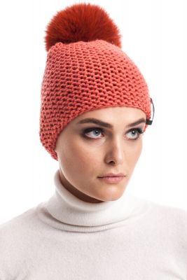 Knitted orange wool hat with pompom orange